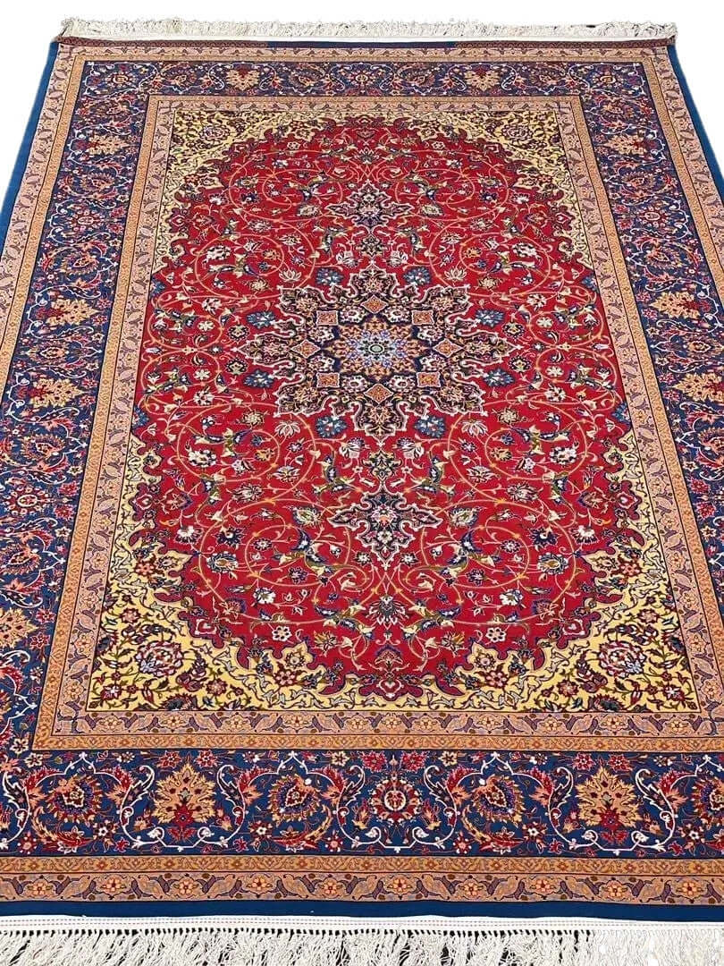 Luxurious red Persian rug with blue and gold accents, hand-knotted by Master Nasorollah Haghighie.